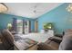 Bright living room featuring vaulted ceilings, a ceiling fan, and a sliding glass door at 149 Angeles Rd, Debary, FL 32713