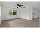 Bright bedroom with light wood flooring, white walls, and a ceiling fan, providing a comfortable living space at 1601 Big Tree Rd # 1301, South Daytona, FL 32119