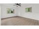 Neutral bedroom with two windows and wood-look vinyl flooring at 1601 Big Tree Rd # 1301, South Daytona, FL 32119