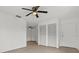 Neutral bedroom with ceiling fan, luxury vinyl flooring, and double closet at 1601 Big Tree Rd # 1301, South Daytona, FL 32119