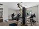 Community workout facility with several exercise machines on hardwood floor and neutral decor at 1601 Big Tree Rd # 1301, South Daytona, FL 32119