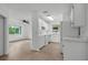 Spacious, bright kitchen with white cabinets, appliances, and light wood flooring, perfect for cooking and entertaining at 1601 Big Tree Rd # 1301, South Daytona, FL 32119