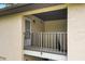 Covered outdoor patio with railings and door to the home, providing a private outdoor space at 1601 Big Tree Rd # 1301, South Daytona, FL 32119