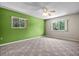 Spacious bedroom with large windows, carpet, and a ceiling fan at 1601 Big Tree Rd # 1302, South Daytona, FL 32119