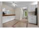 Bright dining area featuring tile floors, ample cabinet space, and a large mirror at 1601 Big Tree Rd # 1302, South Daytona, FL 32119