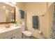 Bathroom with a modern vanity, toilet, shower, and decorative towels at 1617 Tuscaloosa Ave, Daytona Beach, FL 32117