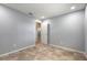 Neutrally painted bedroom featuring tile floors and a doorway at 1617 Tuscaloosa Ave, Daytona Beach, FL 32117
