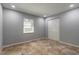 Neutrally painted bedroom featuring tile floors, closet, and a window at 1617 Tuscaloosa Ave, Daytona Beach, FL 32117