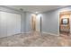 Bedroom featuring tile floors, closet, doorway to bathroom and neutral wall color at 1617 Tuscaloosa Ave, Daytona Beach, FL 32117