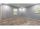 Bright bedroom with two windows, tiled floors, and neutral wall color at 1617 Tuscaloosa Ave, Daytona Beach, FL 32117