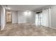 Spacious living room featuring tile floors, neutral walls, and a sliding glass door with lots of natural light at 1617 Tuscaloosa Ave, Daytona Beach, FL 32117