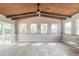 Open concept living room with wood ceiling, ample windows bringing in natural light and tile floors at 1617 Tuscaloosa Ave, Daytona Beach, FL 32117