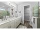 Modern bathroom featuring double sinks, spacious shower, and elegant fixtures at 165 Azure Mist Way, Daytona Beach, FL 32124