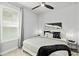 Cozy bedroom with plush bedding, stylish decor, and bright natural light from the window at 165 Azure Mist Way, Daytona Beach, FL 32124