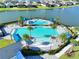 Aerial view of the community pool featuring palm trees and lounge chairs at 165 Azure Mist Way, Daytona Beach, FL 32124