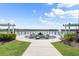 Scenic lakeside fire pit area with comfortable seating, perfect for community gatherings at 165 Azure Mist Way, Daytona Beach, FL 32124