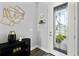Welcoming foyer with decor, featuring a decorative glass front door and neutral walls at 165 Azure Mist Way, Daytona Beach, FL 32124