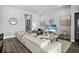 Inviting living room with a comfortable sectional sofa, stylish decor, and open access to other living areas at 165 Azure Mist Way, Daytona Beach, FL 32124