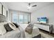 Comfortable main bedroom with plush bedding, accent pillows, and large windows at 165 Azure Mist Way, Daytona Beach, FL 32124
