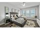 Relaxing main bedroom featuring neutral tones, plantation shutters, and elegant decor at 165 Azure Mist Way, Daytona Beach, FL 32124