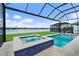 A luxurious screened-in pool and spa offer stunning water views at 165 Azure Mist Way, Daytona Beach, FL 32124