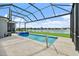 Inviting private pool and spa with a serene lake view, perfect for outdoor entertaining at 165 Azure Mist Way, Daytona Beach, FL 32124