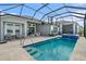 Backyard pool featuring a spillover spa, tanning ledge and outdoor seating area at 165 Azure Mist Way, Daytona Beach, FL 32124