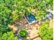 Aerial view of property showcasing its location surrounded by lush greenery and a well-maintained yard at 165 S Massachusetts Ave, Deland, FL 32724