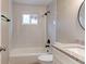 Clean bathroom with white tile shower and granite topped vanity at 165 S Massachusetts Ave, Deland, FL 32724