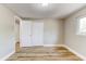Bedroom featuring closet, fresh paint, and modern light-wood flooring at 165 S Massachusetts Ave, Deland, FL 32724