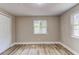 Bedroom featuring closet space, natural light, and modern flooring at 165 S Massachusetts Ave, Deland, FL 32724