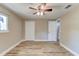 Bedroom featuring a closet, window, and wood-look laminate flooring at 165 S Massachusetts Ave, Deland, FL 32724