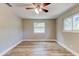 Bedroom with light-wood flooring and windows for natural light at 165 S Massachusetts Ave, Deland, FL 32724