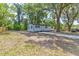 Charming single-story home featuring a well-maintained yard and a lengthy driveway at 165 S Massachusetts Ave, Deland, FL 32724