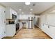Modern kitchen with stainless steel appliances, granite countertops, and white cabinetry at 165 S Massachusetts Ave, Deland, FL 32724
