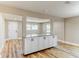 Open concept living area with breakfast bar and durable hardwood floors at 165 S Massachusetts Ave, Deland, FL 32724