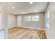 Bright living area with hardwood floors, a front door, and recessed lighting at 165 S Massachusetts Ave, Deland, FL 32724