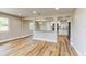 Open floor plan showcasing new floors and views into the kitchen at 165 S Massachusetts Ave, Deland, FL 32724