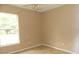 Bedroom with carpet, ceiling fan, and window with view at 1714 Urbana Ave, Deltona, FL 32725