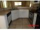 Functional kitchen with ample counter space, white cabinets, and stainless steel appliances at 1714 Urbana Ave, Deltona, FL 32725