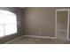 Neutral living room with tile floors and large window at 1714 Urbana Ave, Deltona, FL 32725