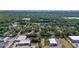 Aerial view of a home nestled among lush greenery and neighboring buildings at 1738 Palm Rd, Ormond Beach, FL 32174