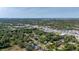 An aerial view showcases the neighborhood with plenty of lush greenery at 1738 Palm Rd, Ormond Beach, FL 32174