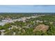An aerial view showcases the neighborhood with plenty of lush greenery at 1738 Palm Rd, Ormond Beach, FL 32174