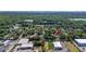 Aerial view of a home nestled among lush greenery and neighboring buildings at 1738 Palm Rd, Ormond Beach, FL 32174