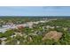 An aerial view showcases the neighborhood with plenty of lush greenery at 1738 Palm Rd, Ormond Beach, FL 32174