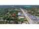 Aerial view of a home with neighborhood amenities and nearby commercial area at 1738 Palm Rd, Ormond Beach, FL 32174