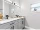 Bathroom featuring double vanity with marble countertop and sleek fixtures at 1738 Palm Rd, Ormond Beach, FL 32174