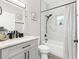 Bathroom featuring marble walk-in shower and gray vanity at 1738 Palm Rd, Ormond Beach, FL 32174