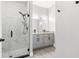 Modern bathroom featuring a dual sink vanity, gray cabinets, and a glass enclosed shower at 1738 Palm Rd, Ormond Beach, FL 32174